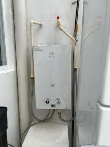 a water heater in a corner of a wall at Cancun15 3 Bedrooms with private Bathrooms 15 min Airport 20 min Beach in Cancún