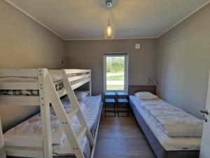 Postel nebo postele na pokoji v ubytování Åminne Fritid & Havsbad AB + 37 fotografií