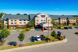 an aerial view of a hotel with a parking lot at Fairfield Inn & Suites Memphis Olive Branch in Olive Branch
