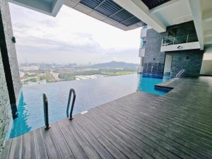 a swimming pool with a view of the water at Lion Home in Seri Kembangan