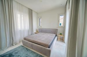 Ліжко або ліжка в номері Lustica Bay Apartment Iva By 2bhome