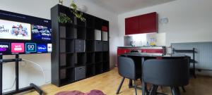 a kitchen with a table and two chairs in a room at Fitness loft 50 m2 in Zemst