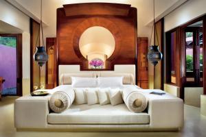 a bedroom with a large white bed in a room at Phulay Bay, A Ritz-Carlton Reserve in Tab Kaek Beach