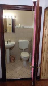a bathroom with a toilet and a sink at Casa Lenzi in Portoferraio