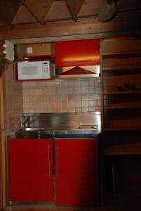 Kuchyň nebo kuchyňský kout v ubytování Le Vieux Chalet