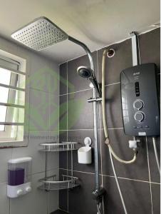 a shower with a shower head in a bathroom at 3R@7pax++ Spacious Space Putrajaya. in Putrajaya
