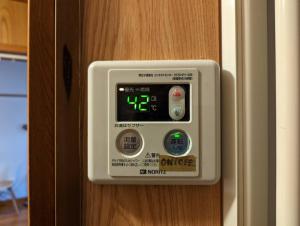 a control panel on a door of a room at 【豊和マンション稲荷302号室】伏見稲荷駅徒歩３分！Free Wifi付のお宿！ in Kyoto