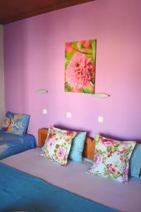 a bedroom with two beds and a painting on the wall at Studios Centro 6 - 2nd Floor in Potos