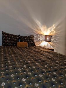 En eller flere senge i et værelse på "Le coquillage" appartement proche plage