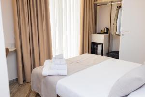 Cama ou camas em um quarto em PATIO MARE