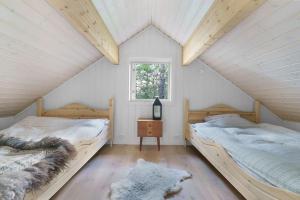 Postel nebo postele na pokoji v ubytování Cabin in Malangen