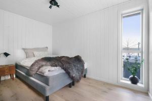 Postel nebo postele na pokoji v ubytování Cabin in Malangen