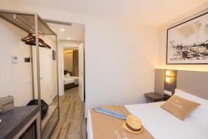 Cama ou camas em um quarto em PATIO MARE