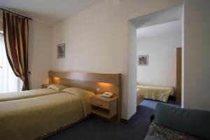 Katil atau katil-katil dalam bilik di Hotel Alberello