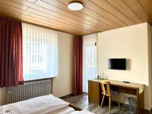 TV a/nebo společenská místnost v ubytování Pension Hubertus