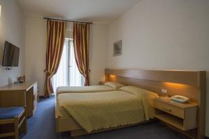 Postel nebo postele na pokoji v ubytování Hotel Alberello + 37 fotografií