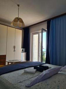 Łóżko lub łóżka w pokoju w obiekcie Rooms Raos