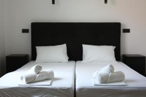 A bed or beds in a room at Apartman Avala Beograd