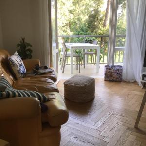 a living room with a couch and a table at Endless Summer in Viareggio