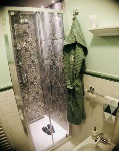 a shower stall in a bathroom with a sink at Casa Margherita in Florence