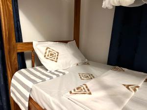 Ένα ή περισσότερα κρεβάτια σε δωμάτιο στο Serene Abodes