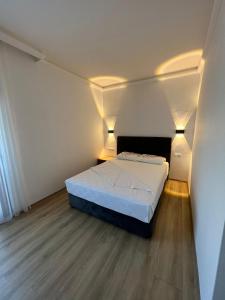Postel nebo postele na pokoji v ubytování Asimado Hotel