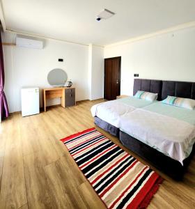 Postel nebo postele na pokoji v ubytování Asimado Hotel