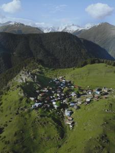 an aerial view of a village on a mountain at A North Homestay in Omalo