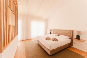 Postel nebo postele na pokoji v ubytování VILLA DOS R'S + 37 fotografií