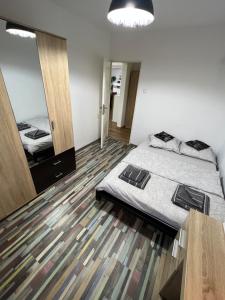 Posteľ alebo postele v izbe v ubytovaní Aparthotel Aurel Vlaicu City Center