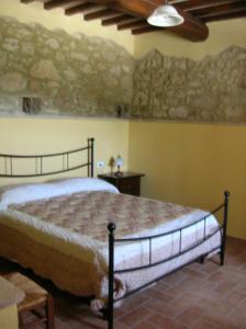 Ένα ή περισσότερα κρεβάτια σε δωμάτιο στο Casa Trastullo