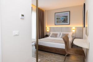Cama ou camas em um quarto em PATIO MARE