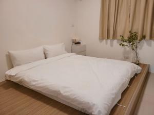 Letto o letti in una camera di On My Way Taitung Hostel