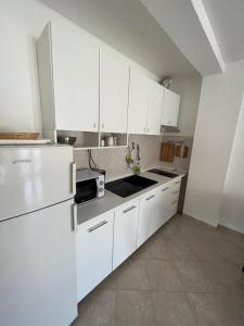 Kuchyň nebo kuchyňský kout v ubytování Apartments and Rooms Markovski