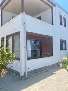 a white building with windows and a person in it at İncebel in Dalaman