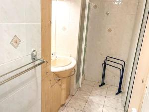 a bathroom with a sink and a shower at Horizon YourHostHelper in Saint-Laurent-du-Var