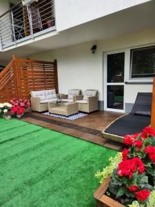 Vonkajšia záhrada v ubytovaní APARTAMENT 4B BLUE MARINE Poddąbie Basen Odkryty Brodziki Plac Zabaw