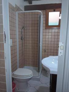 a bathroom with a shower and a toilet and a sink at Camping village Internazionale in Metaponto