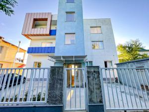 a building with a gate in front of it at Chakvi Sunset in Chakvi +5 photos