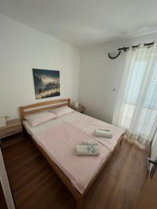 Postel nebo postele na pokoji v ubytování Apartments and Rooms Markovski