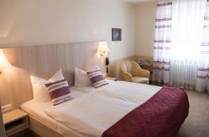 Postel nebo postele na pokoji v ubytování Hotel Excelsior