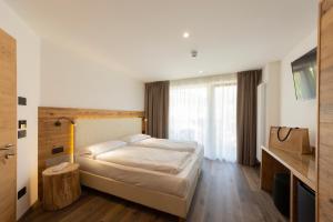 Voodi või voodid majutusasutuse Active Alm Hotel toas