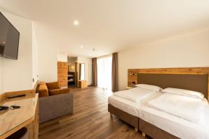 Voodi või voodid majutusasutuse Active Alm Hotel toas