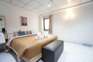 Postel nebo postele na pokoji v ubytování Maruay Living Apartment 506 (Khaosan/Chinatown/Samyot MRT)