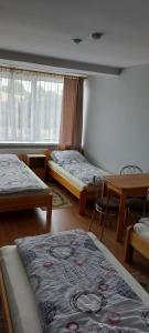 Postel nebo postele na pokoji v ubytování Pokoje Gościnne HEVEN + 6 fotografií