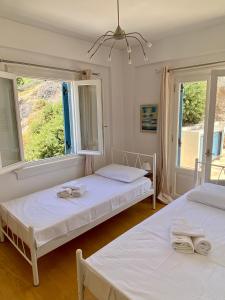Krevet ili kreveti u jedinici u okviru objekta Elichrisos Apartment Spetses +15 fotografija