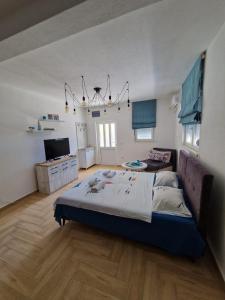 a bedroom with a large bed in a room at Studio apartman Happy Home in Tivat