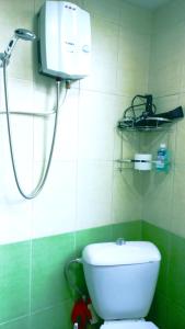 a bathroom with a shower and a white toilet at City Center Suit in Yerevan
