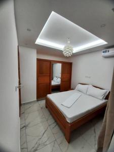 Ένα ή περισσότερα κρεβάτια σε δωμάτιο στο Bel appartement a Yaoundé Bastos