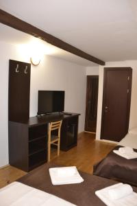 Postel nebo postele na pokoji v ubytování Casa "Cabana Varciorog Arieseni"